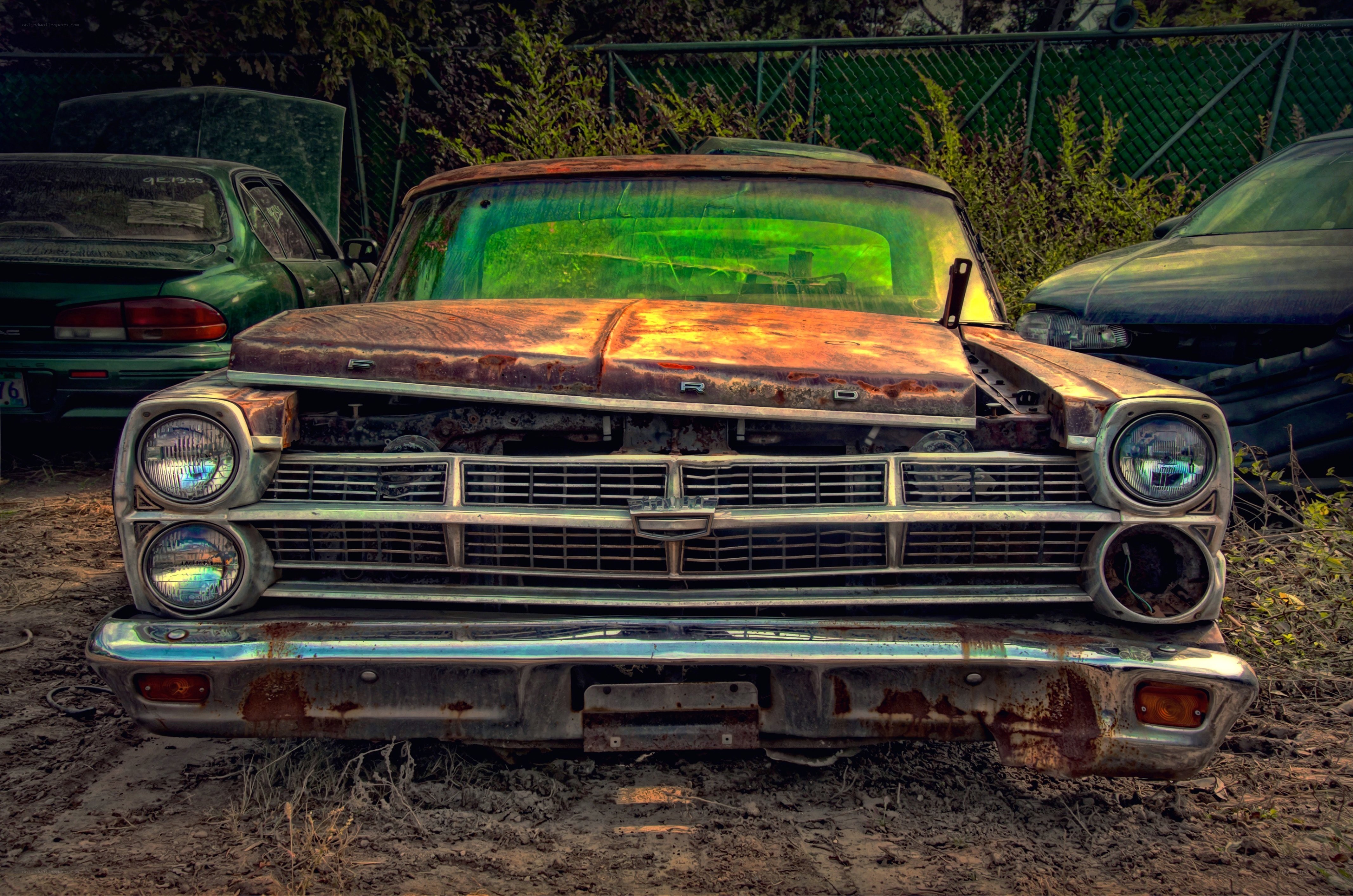 Rusty old car in junkyard
