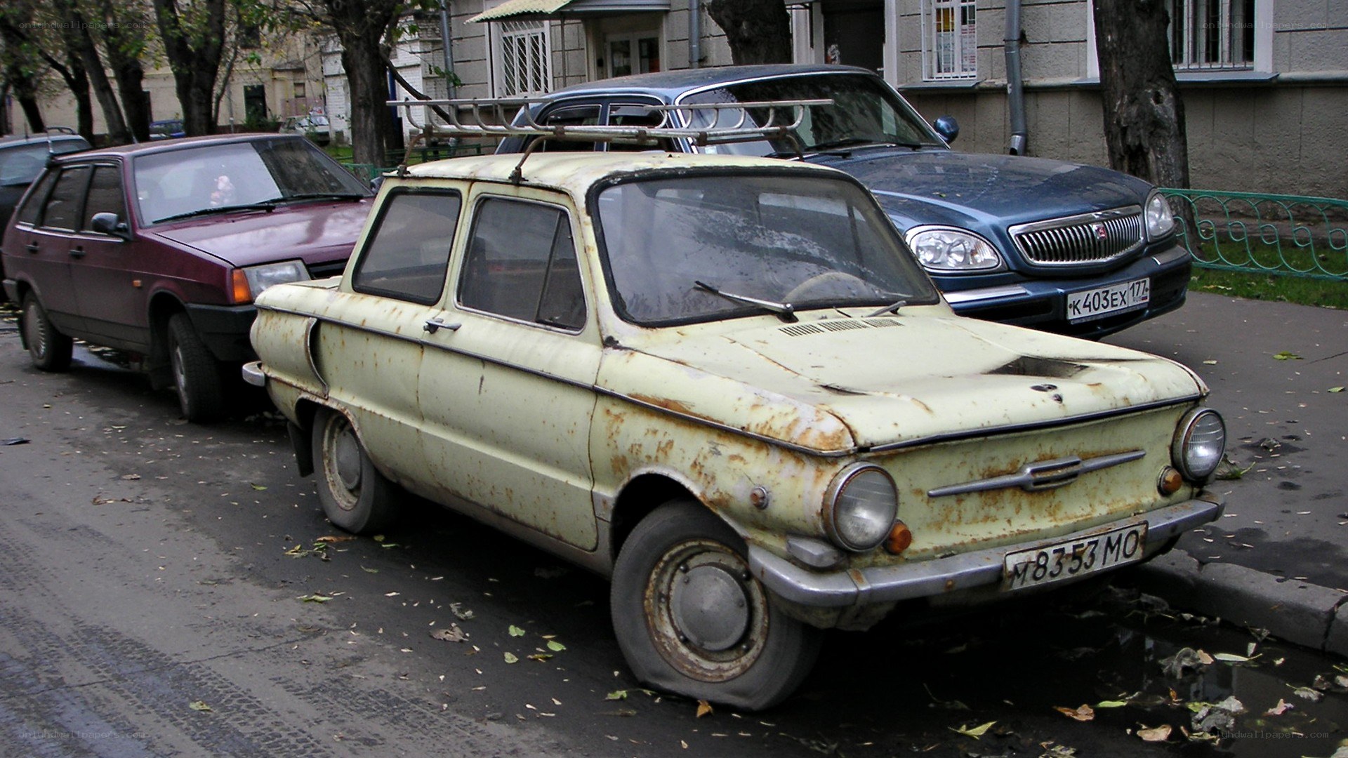 Rusty old car on street