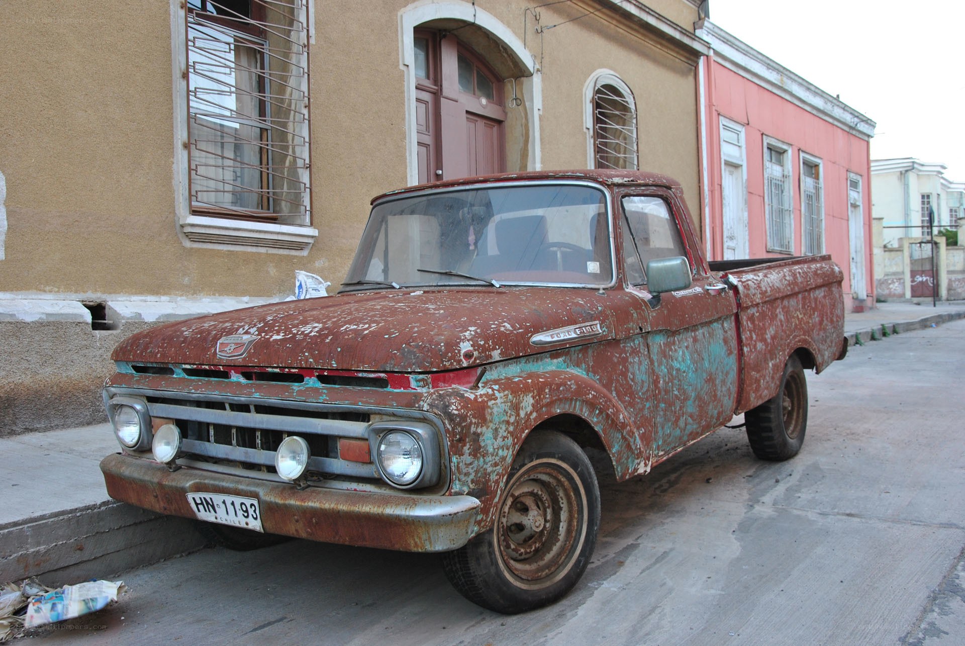 Rusty old pickup truck on street