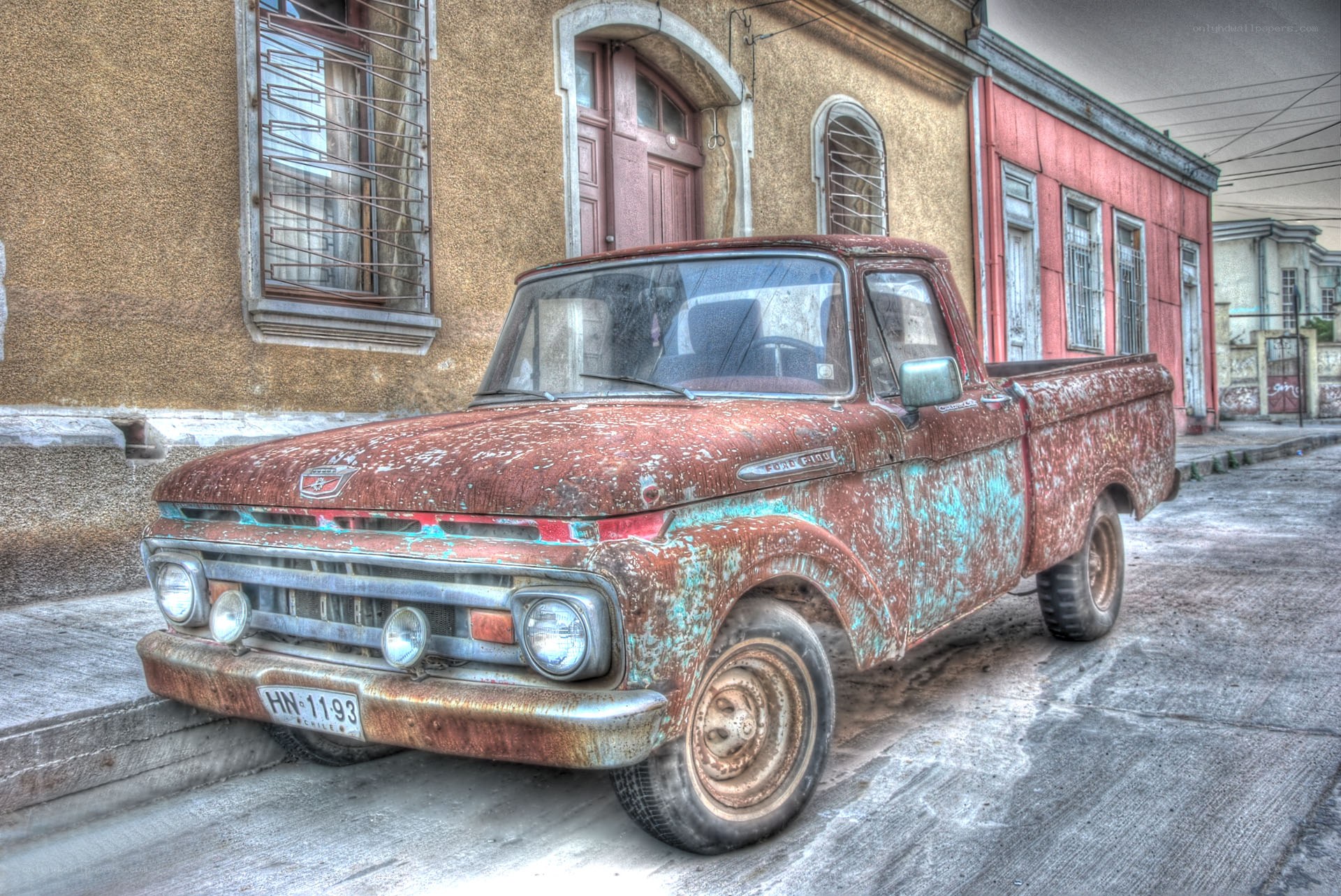 Rusty old pickup truck on street