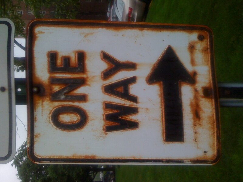 Rusty one way sign