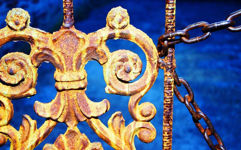 Rusty ornate iron gate