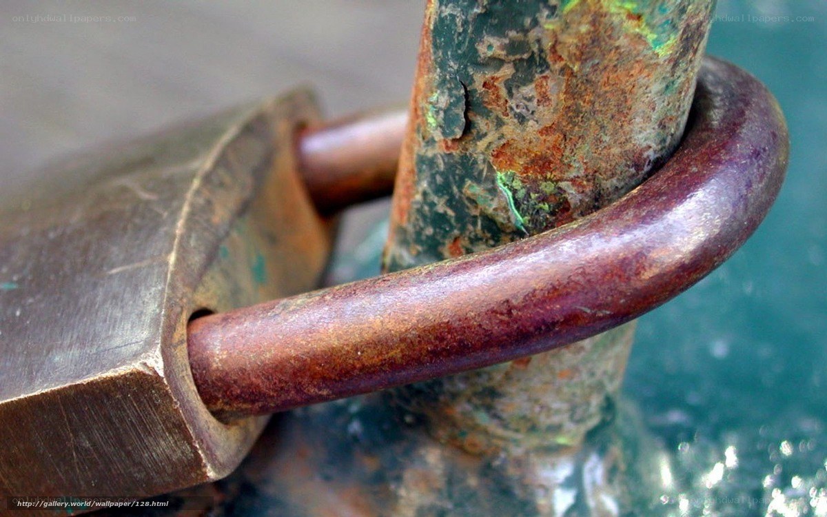Rusty padlock on a pole