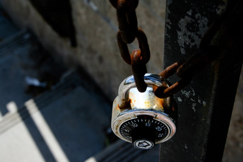 Rusty padlock on chain