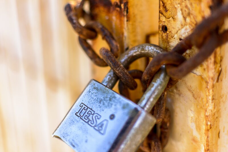Rusty padlock on chain