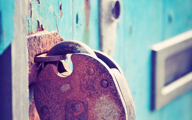 Rusty Padlock on Door