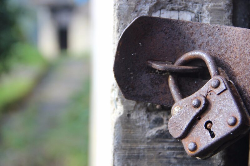 Rusty Padlock on Gate