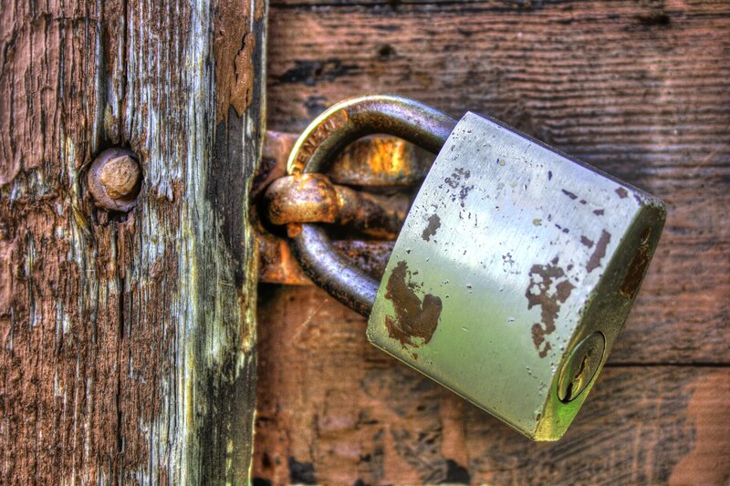 Rusty Padlock on Wood — Brown, Dramatic