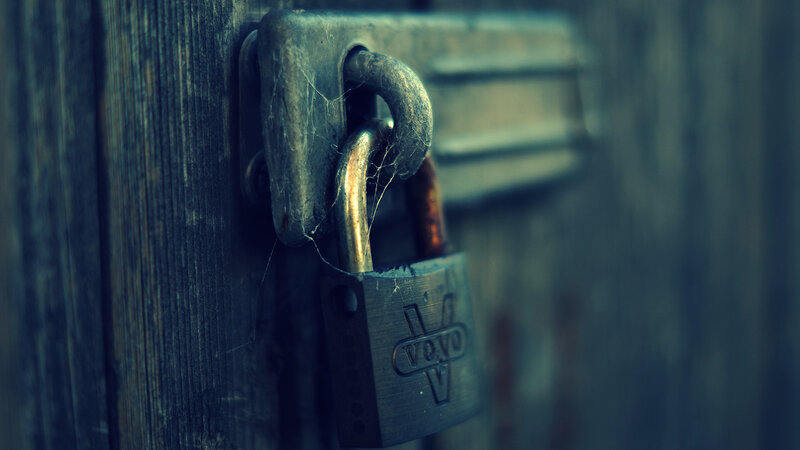 Rusty Padlock on Wood
