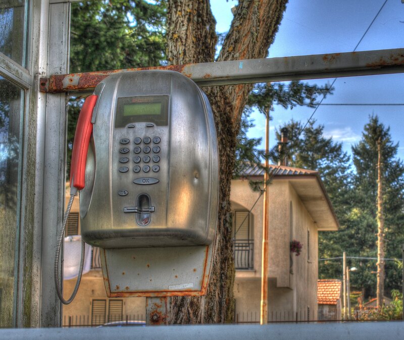 Rusty payphone in outdoor setting