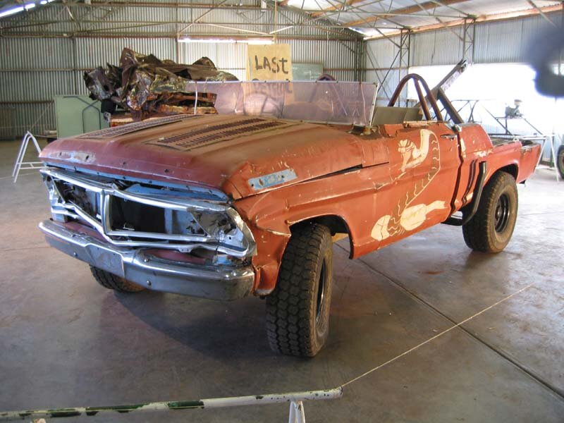 Rusty pickup truck in workshop