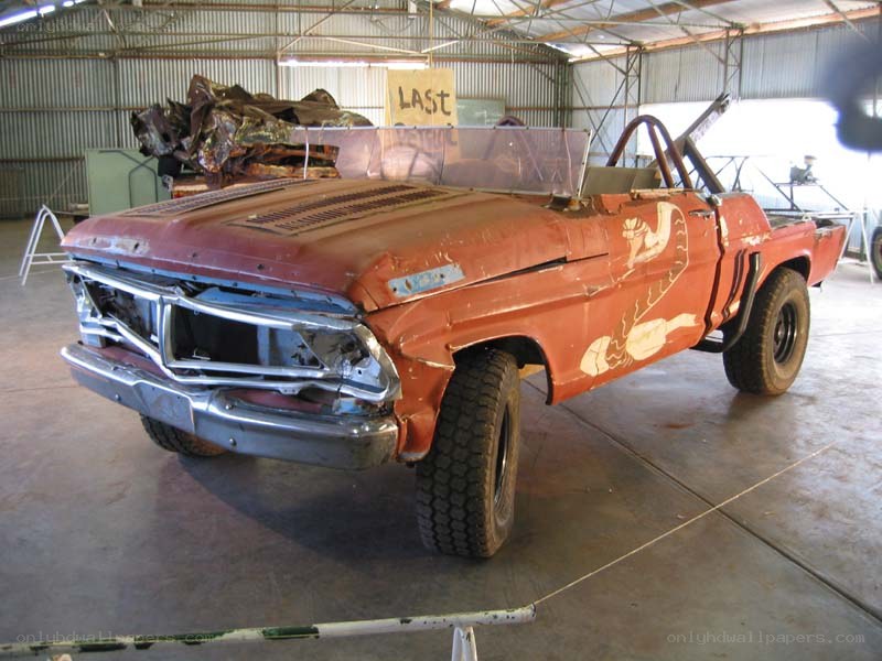 Rusty pickup truck in workshop