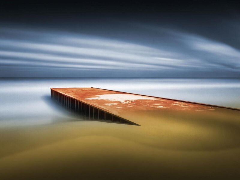 Rusty pier at dusk