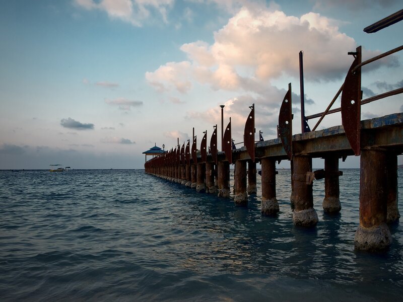 Rusty pier at sunset