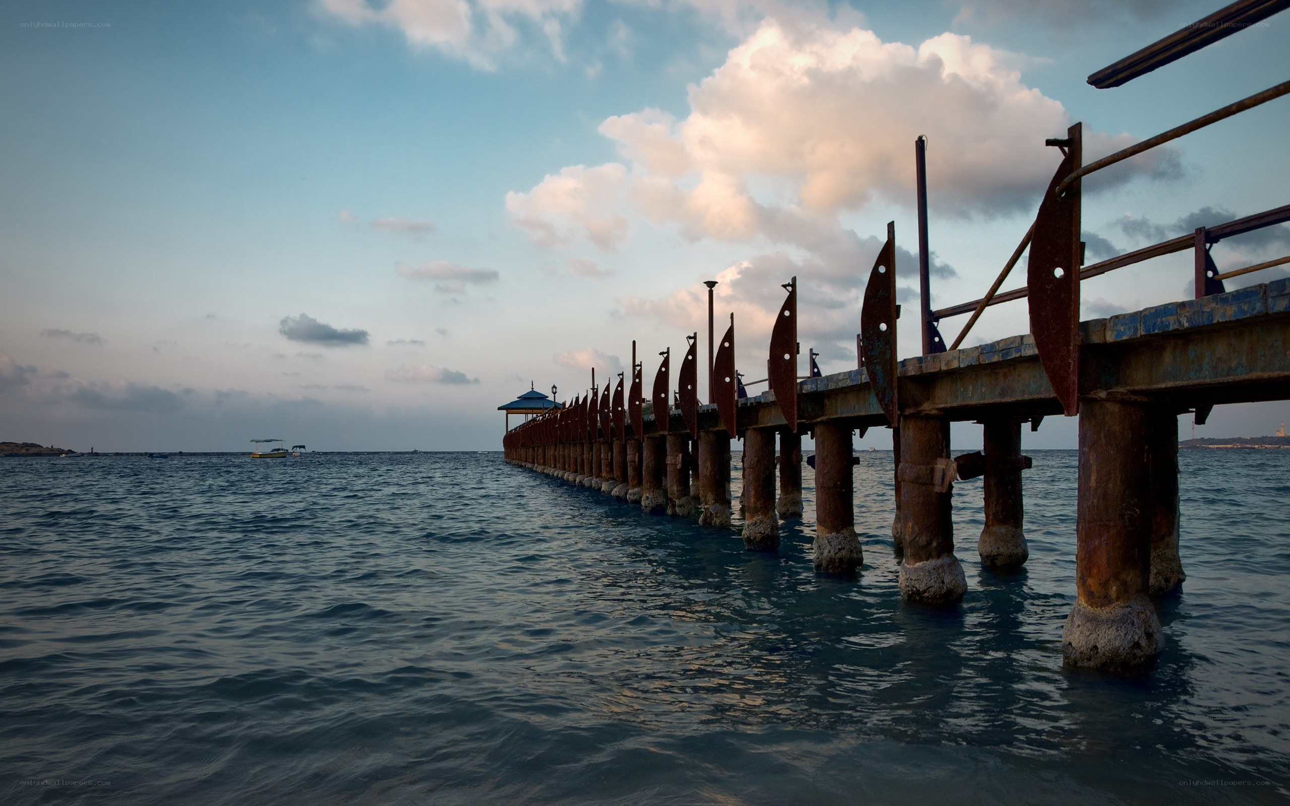 Rusty pier extending into the sea