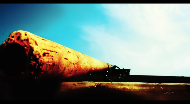 Rusty pipe against blue sky