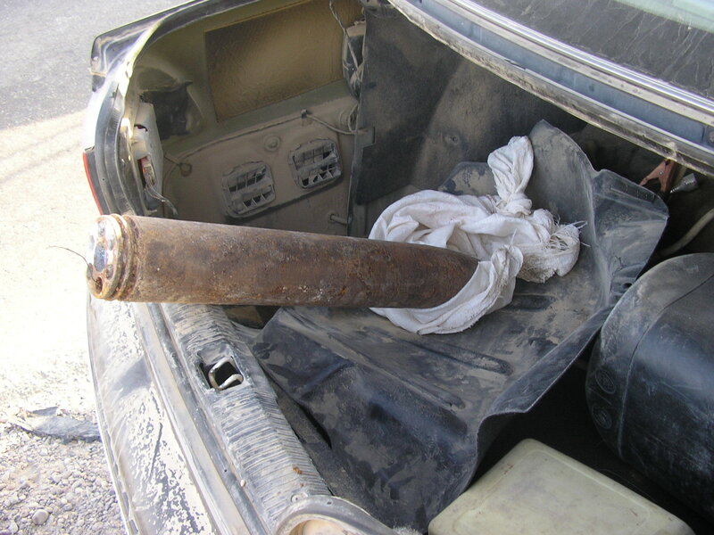 Rusty pipe in car trunk