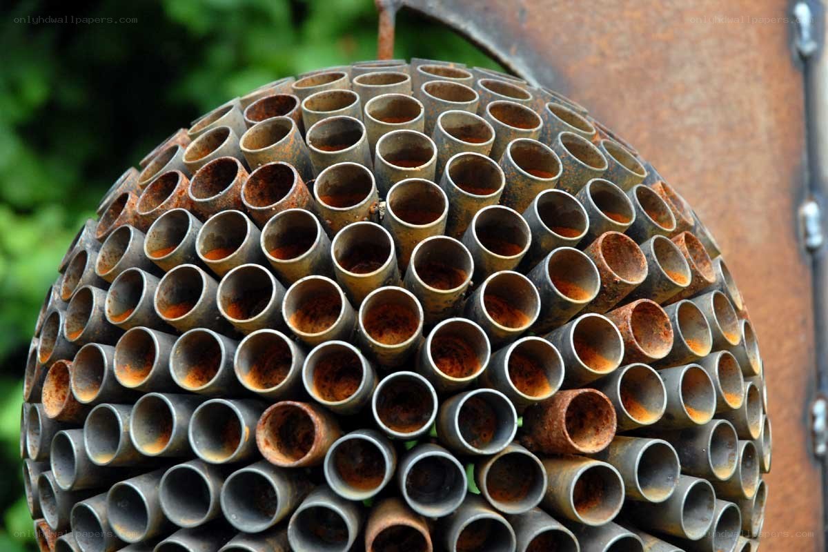 Rusty pipe sphere sculpture