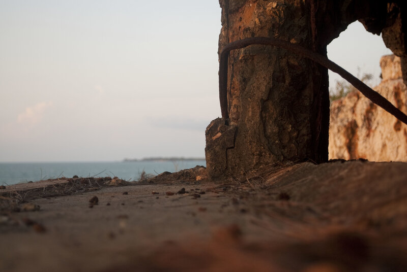 Rusty post by the sea