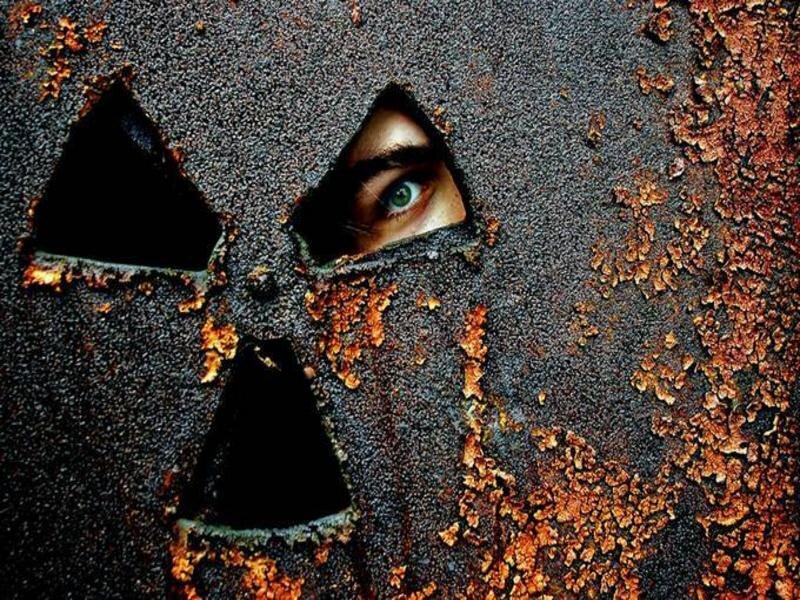 Rusty radiation symbol with eye
