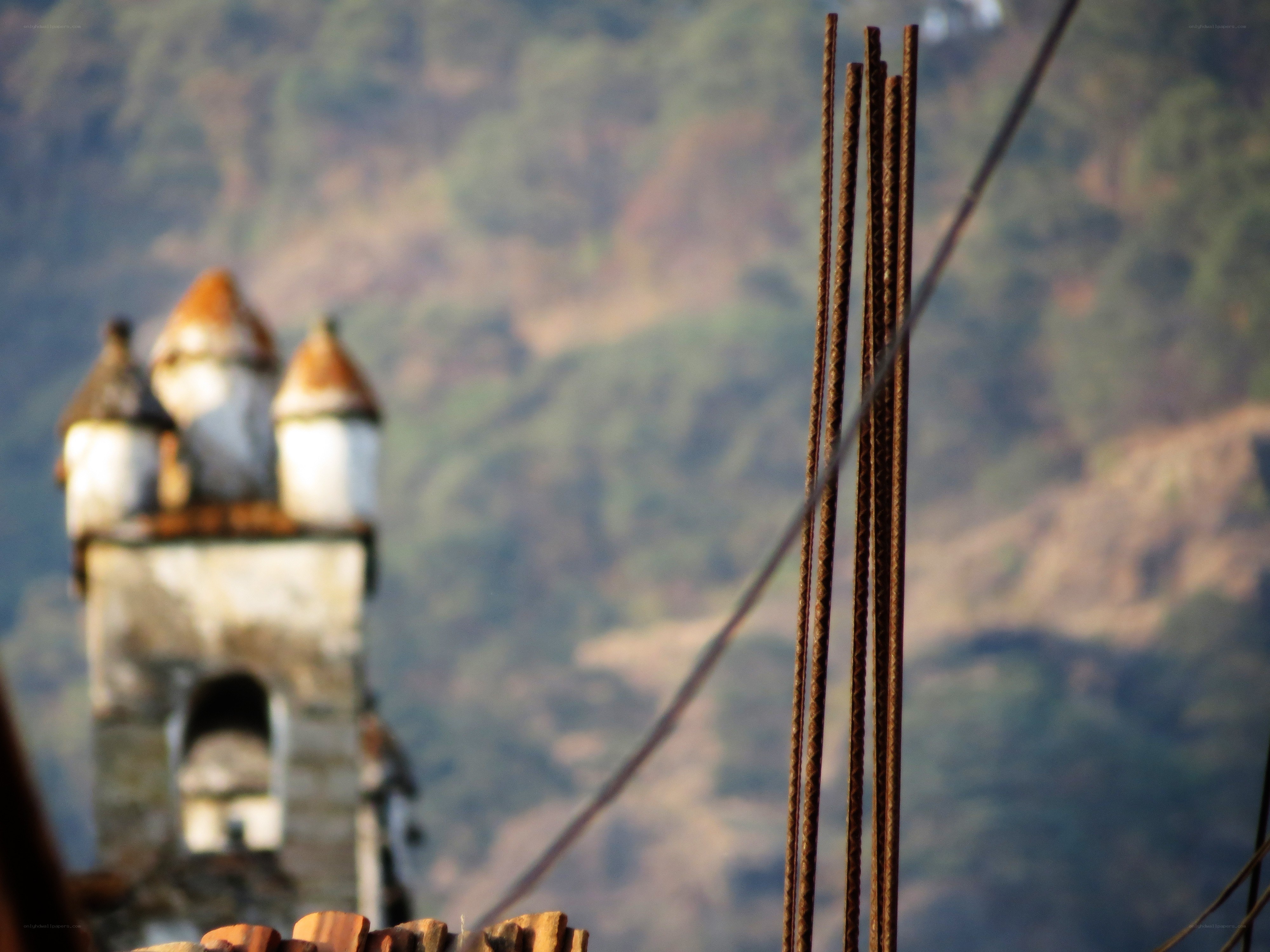 Rusty rebar and church tower