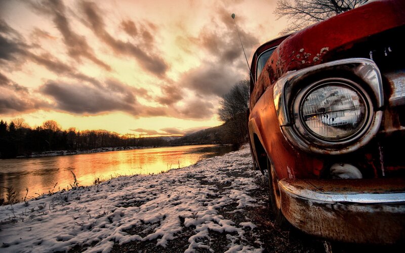 Rusty Red Car by River — Dramatic, Winter