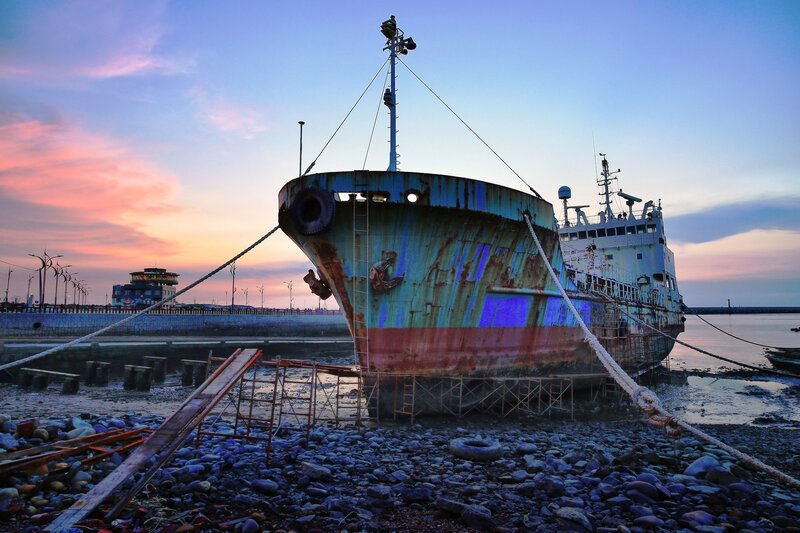 Rusty Ship on Shore