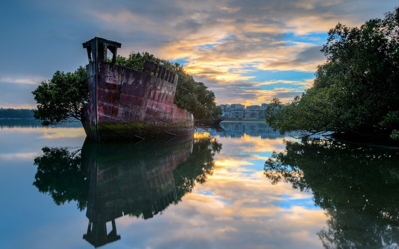 Rusty Shipwreck in Water — Blue, Serene, Sunset, Photograph