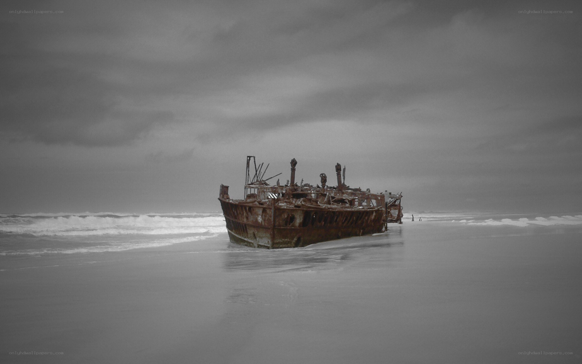 Rusty shipwreck on beach