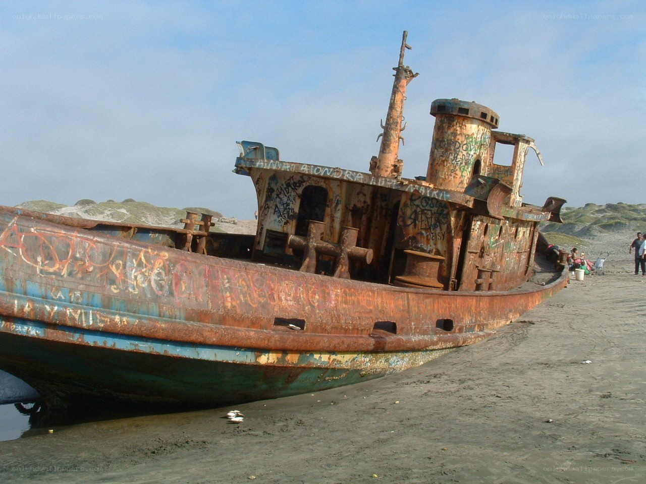 Rusty shipwreck on beach