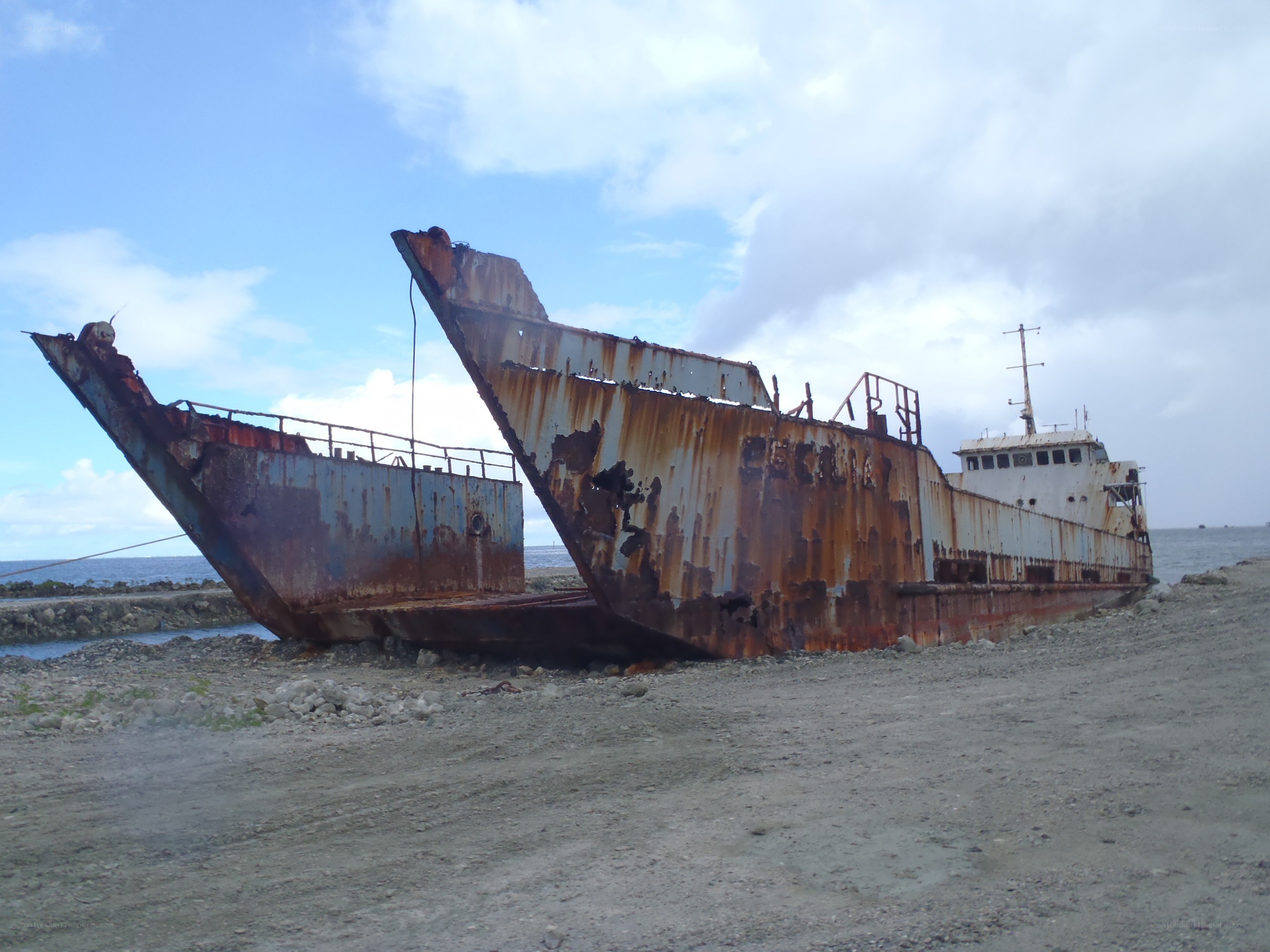 Rusty shipwreck on beach
