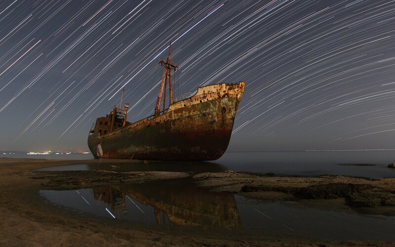 Rusty Shipwreck on Beach — Blue, Dramatic