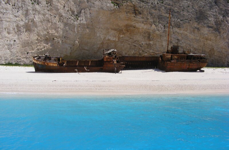 Rusty Shipwreck on Beach — Blue