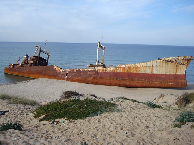 Rusty Shipwreck on Beach — Brown, Desolate, Afternoon