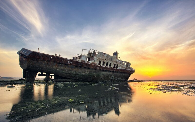 Rusty Shipwreck on Shore — Orange