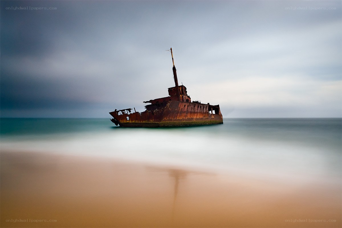 Rusty shipwreck on the shore