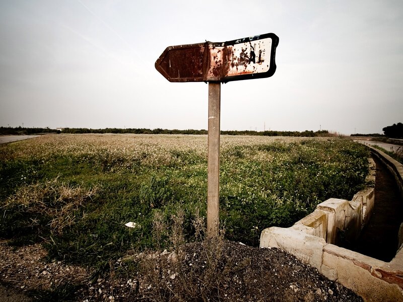 Rusty Signpost in Field — Green