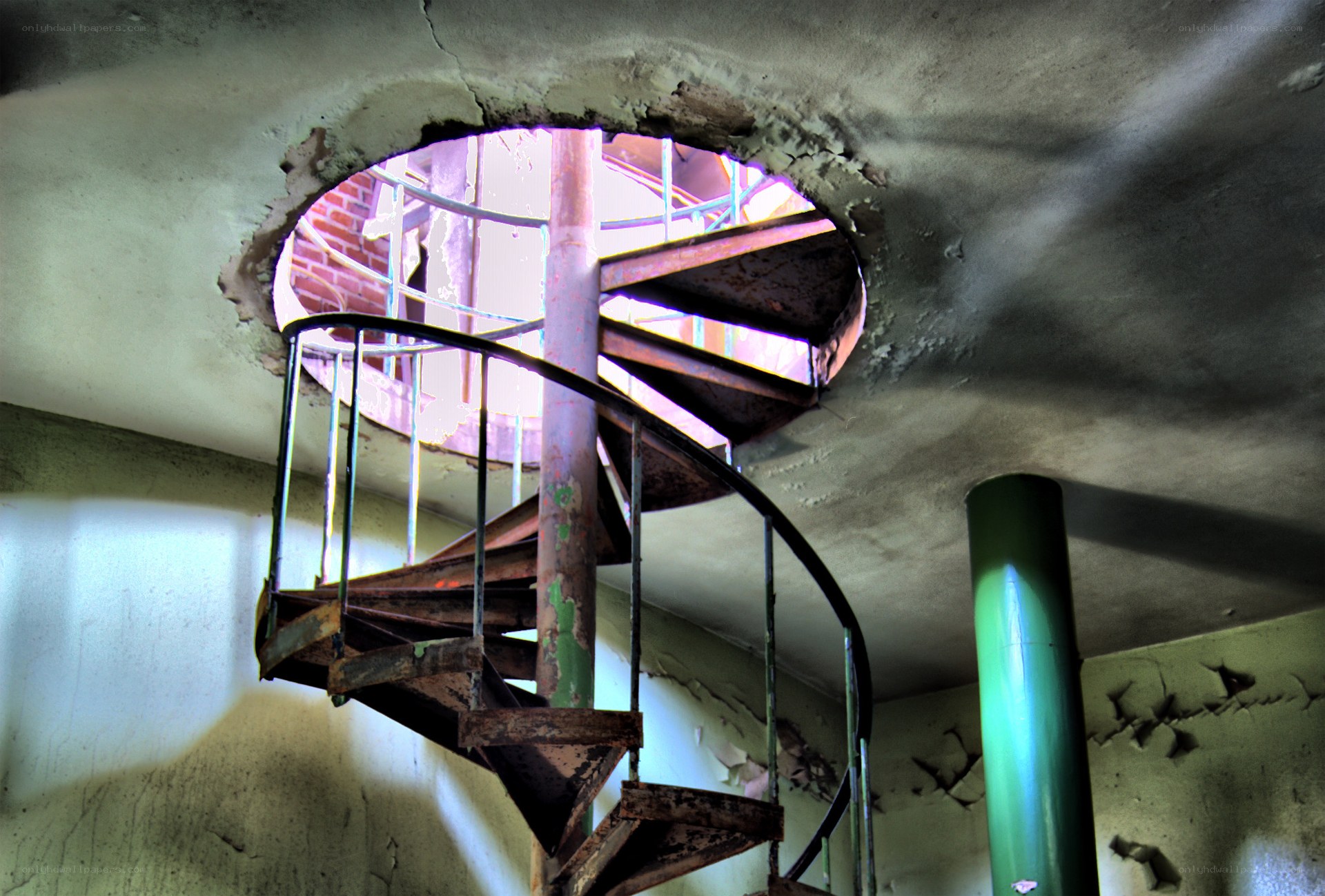 Rusty spiral staircase in abandoned building