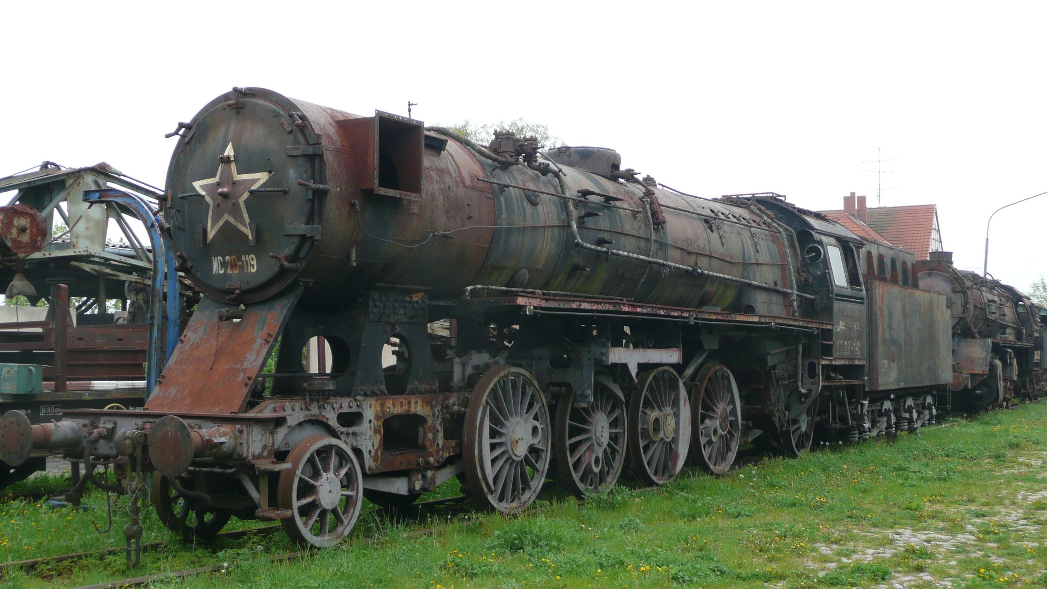 Rusty steam locomotive on display