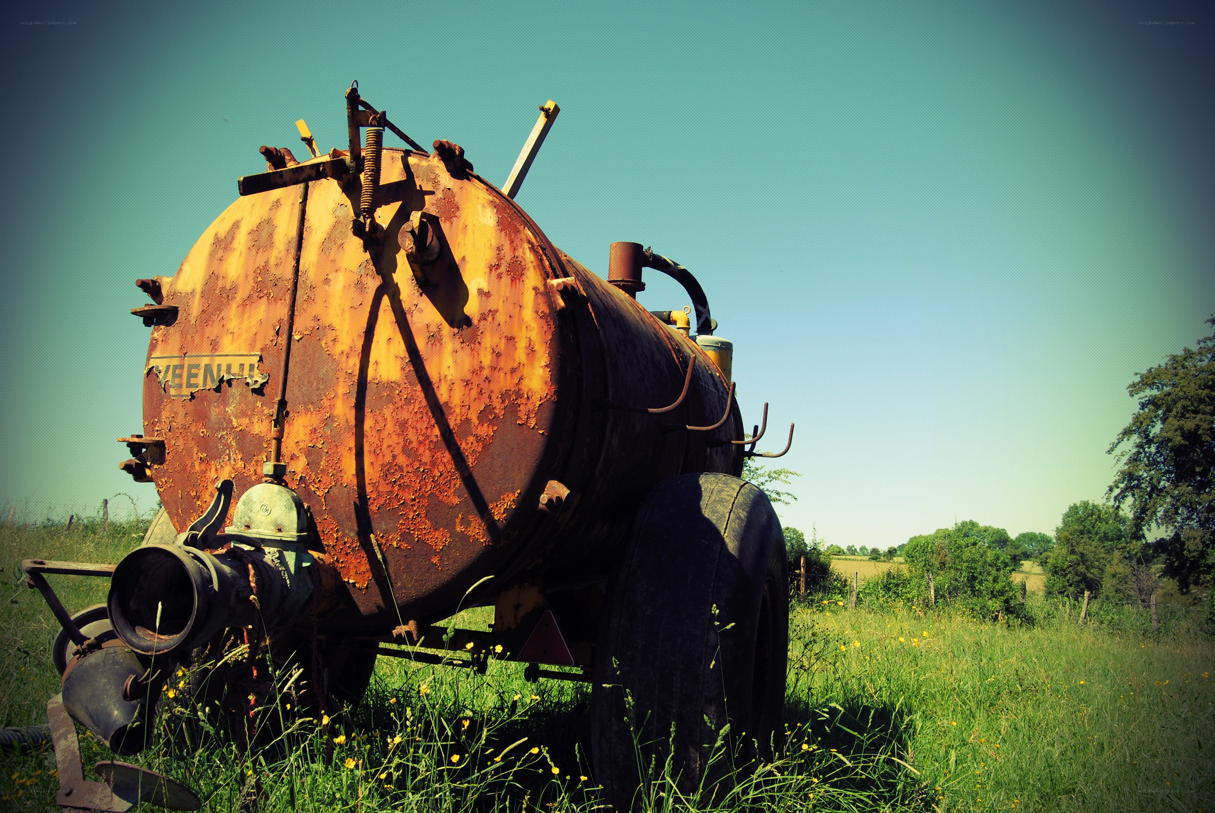 Rusty tank in a field