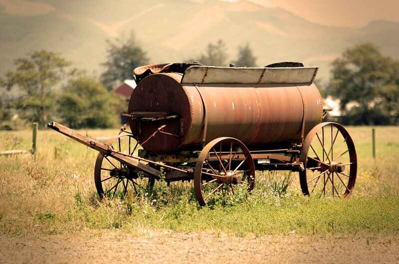 Rusty tank wagon in a field