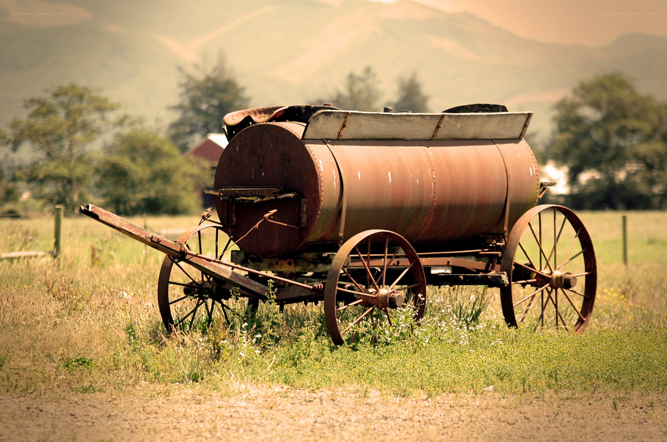 Rusty tank wagon in a field
