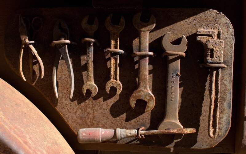Rusty tools on a wall