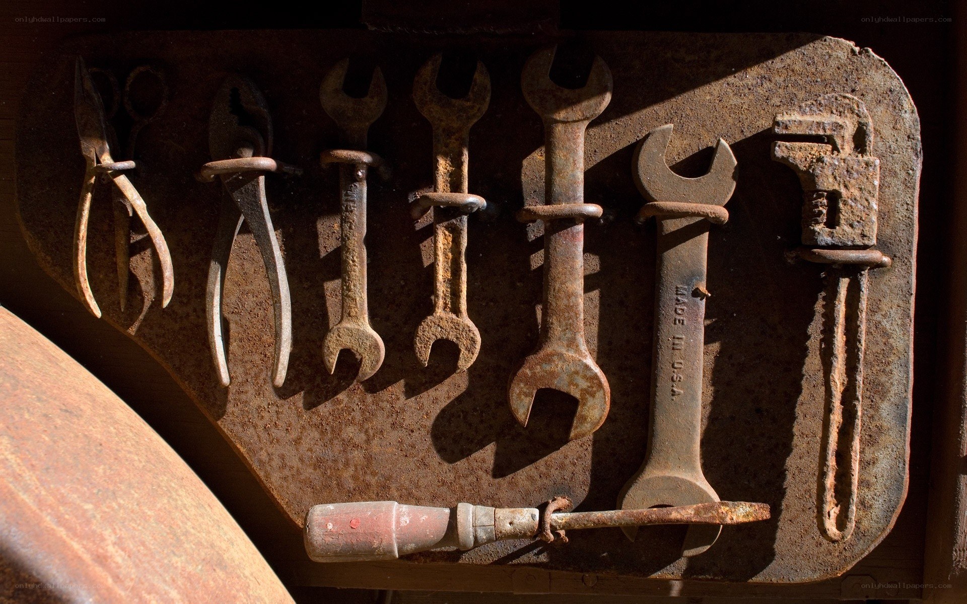 Rusty tools on a wall