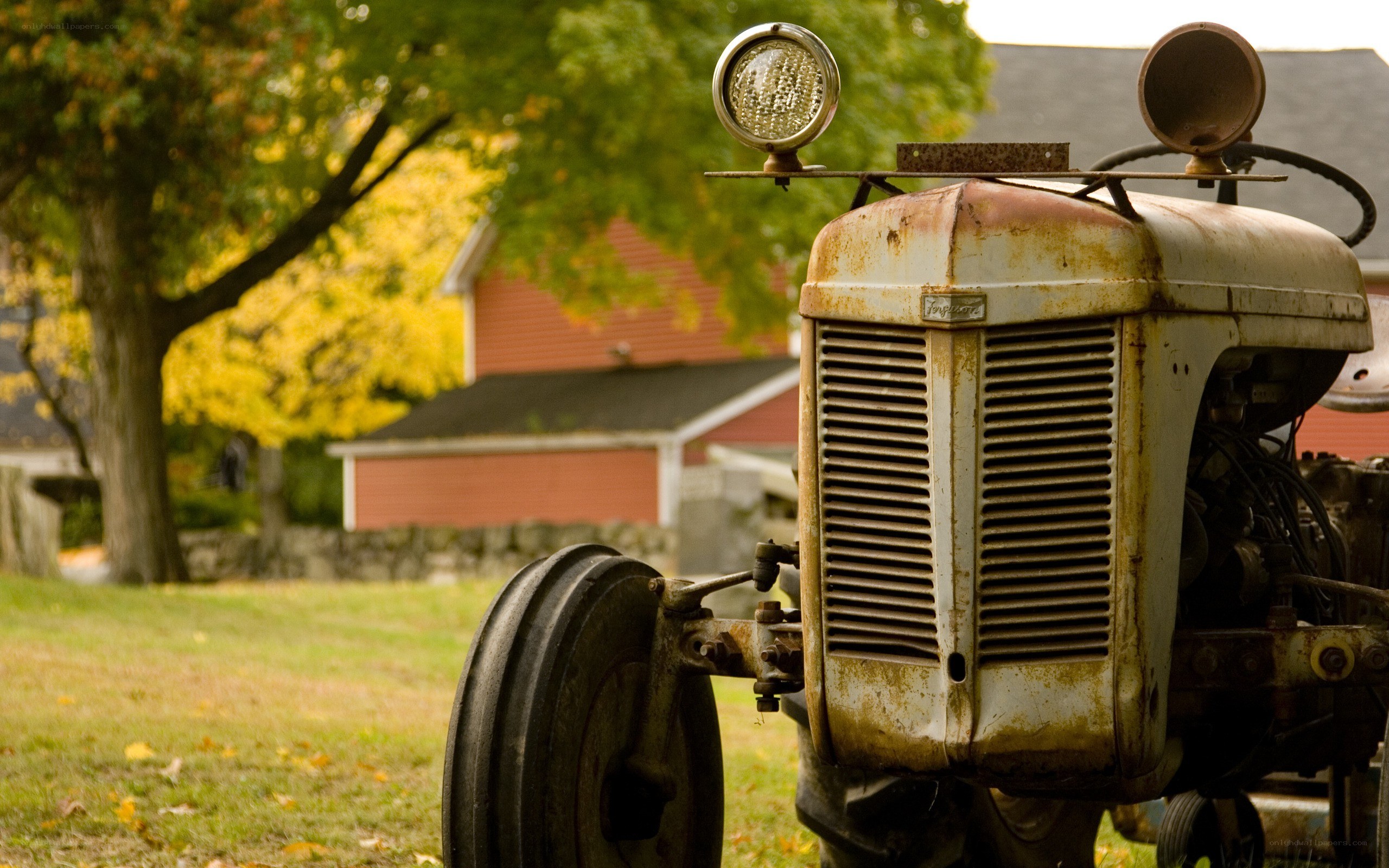 Rusty tractor in autumn field