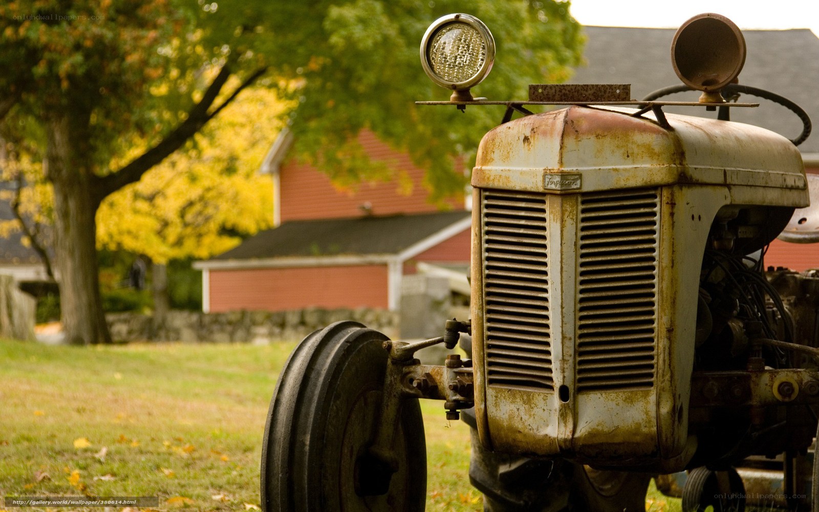 Rusty tractor in autumn field
