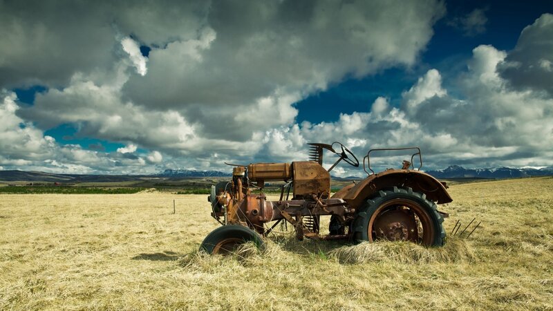 Rusty Tractor in Field — Brown