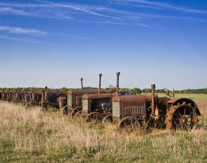 Rusty tractors in a field