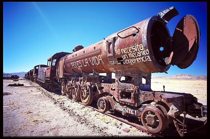 Rusty train graveyard in desert