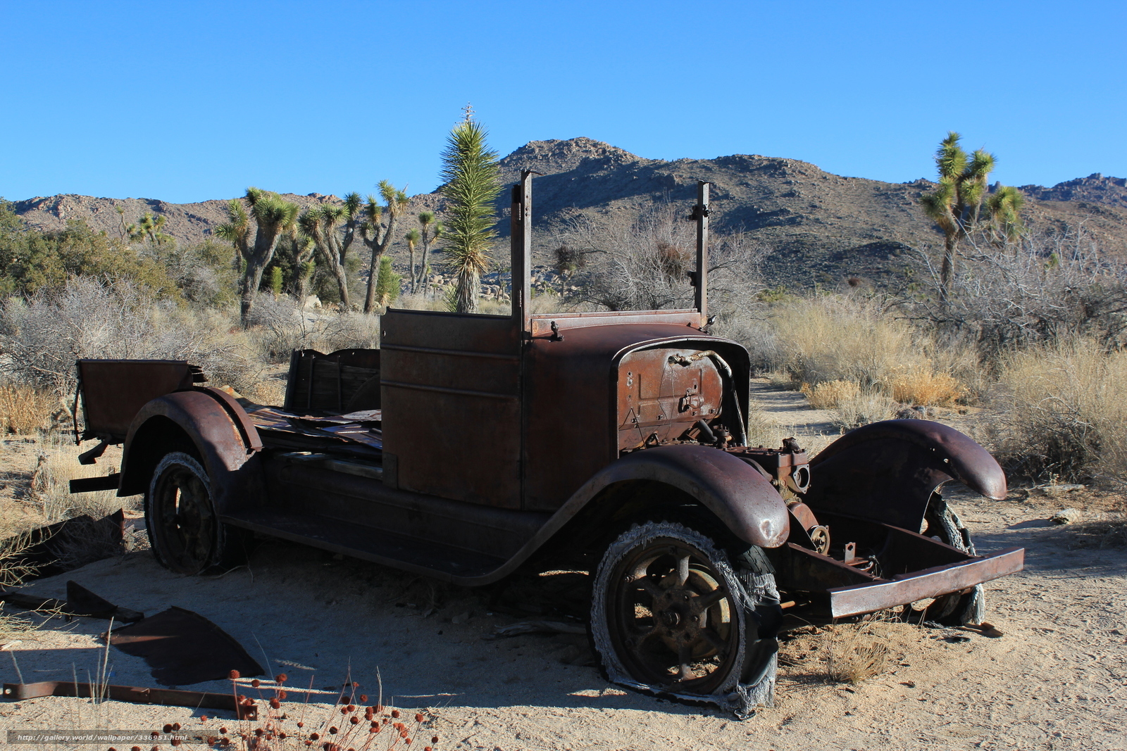Rusty truck in desert landscape